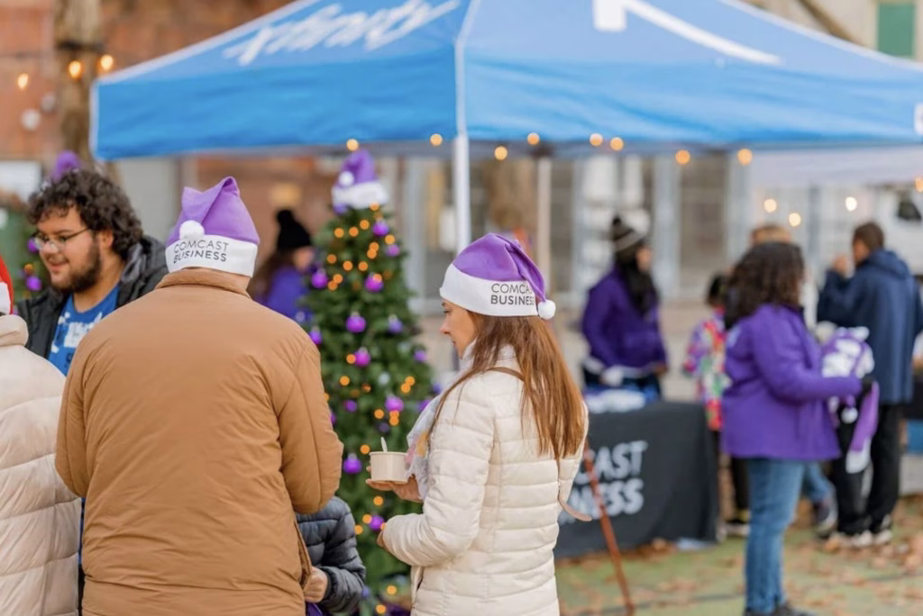 Two people at a holiday market.